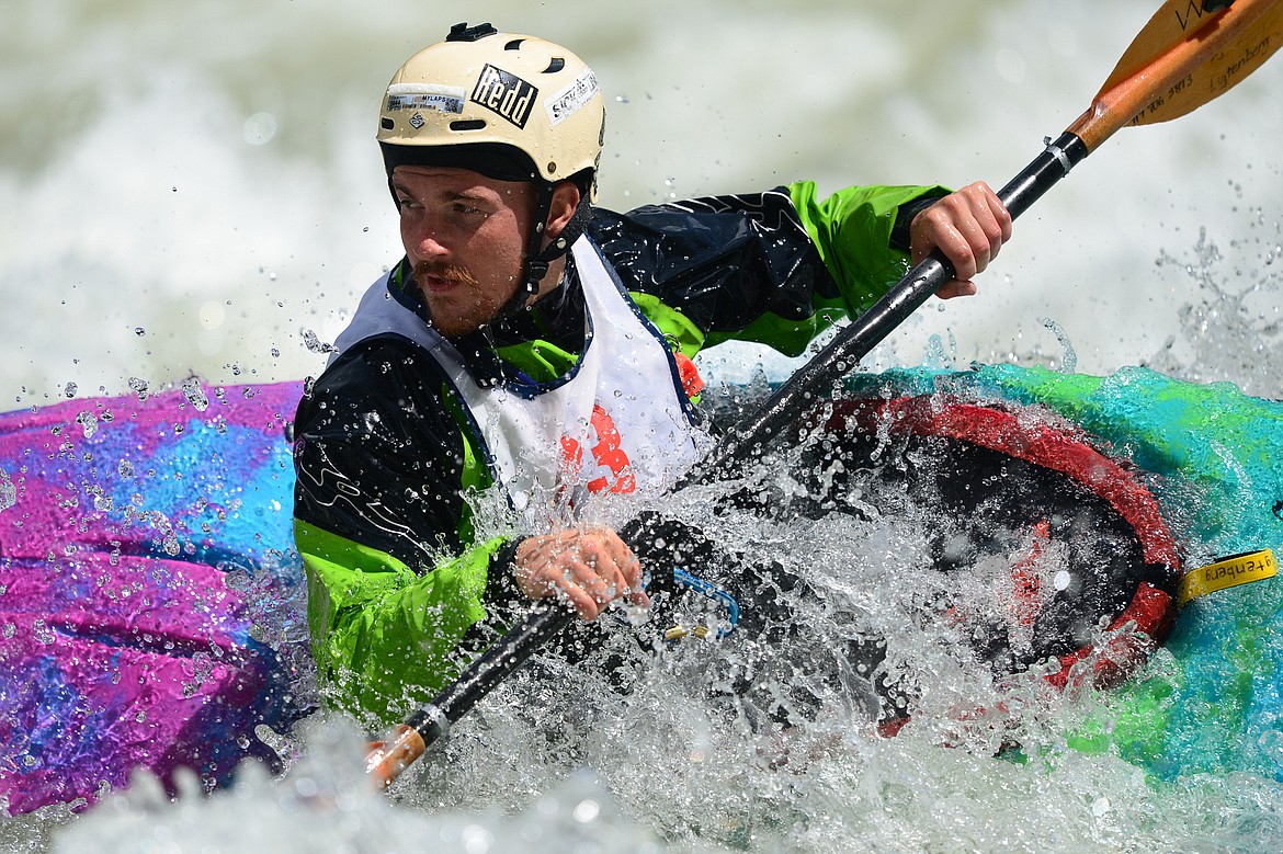 Kayakers navigate the Swan River during the Expert Slalom event at the Bigfork Whitewater Festival in Bigfork on Saturday. (Casey Kreider/Daily Inter Lake)