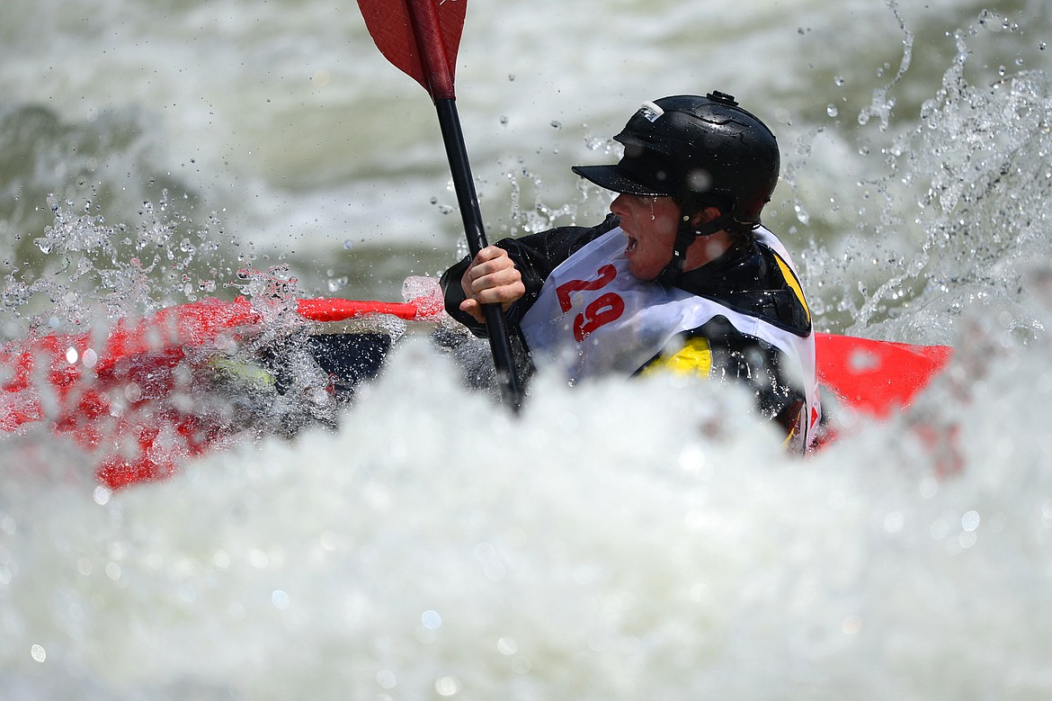 Kayakers navigate the Swan River during the Expert Slalom event at the Bigfork Whitewater Festival in Bigfork on Saturday. (Casey Kreider/Daily Inter Lake)