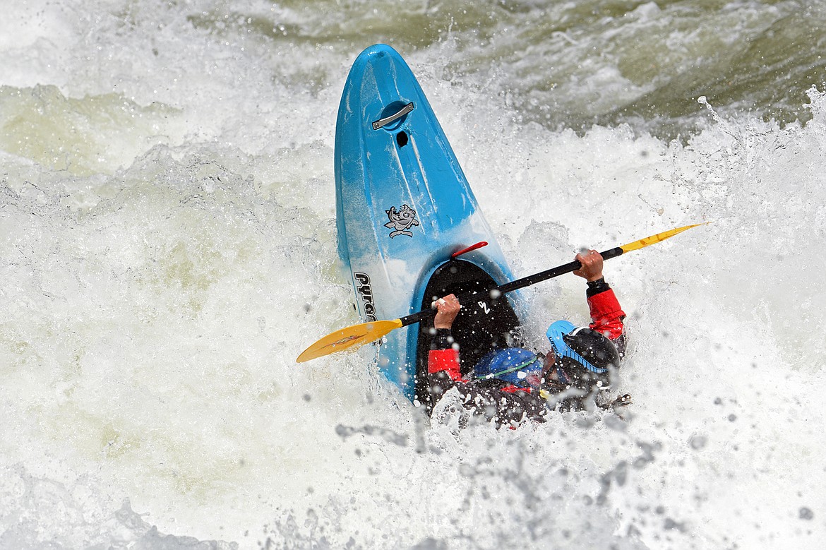 Kayakers navigate the Swan River during the Expert Slalom event at the Bigfork Whitewater Festival in Bigfork on Saturday. (Casey Kreider/Daily Inter Lake)