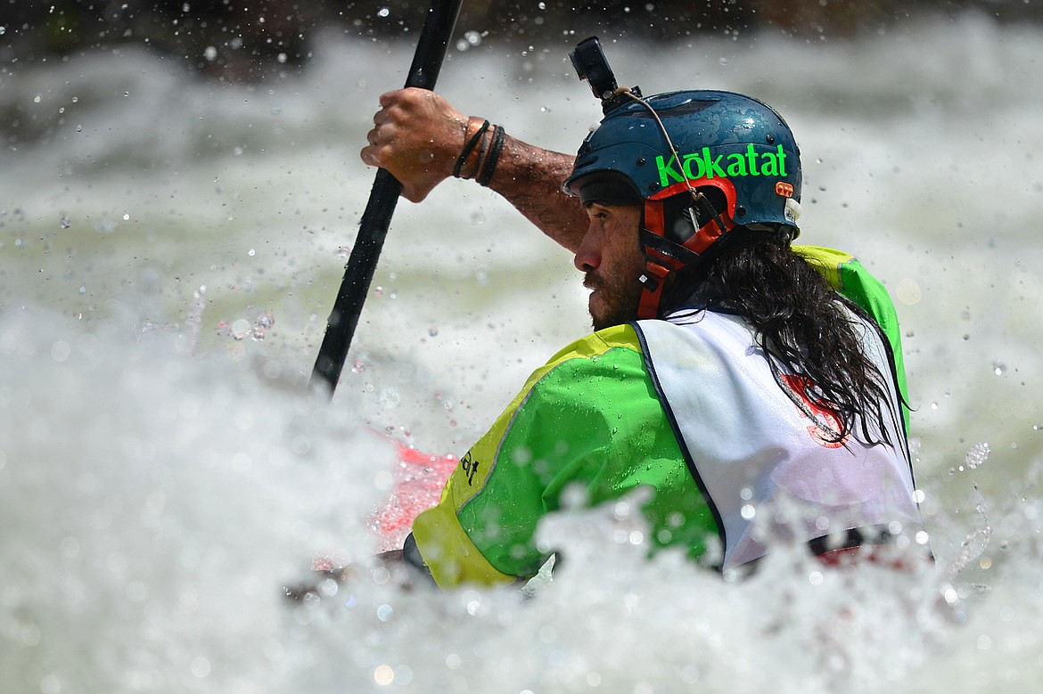 Kayakers navigate the Swan River during the Expert Slalom event at the Bigfork Whitewater Festival in Bigfork on Saturday. (Casey Kreider/Daily Inter Lake)