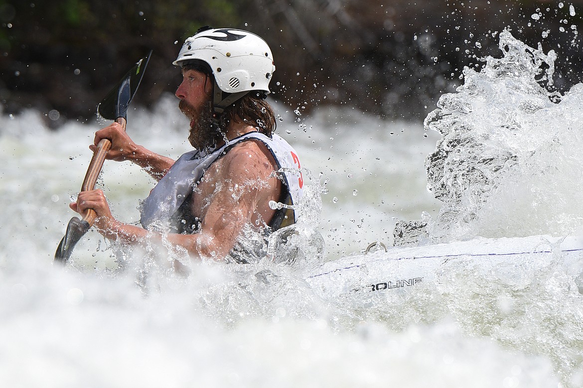 Kayakers navigate the Swan River during the Expert Slalom event at the Bigfork Whitewater Festival in Bigfork on Saturday. (Casey Kreider/Daily Inter Lake)