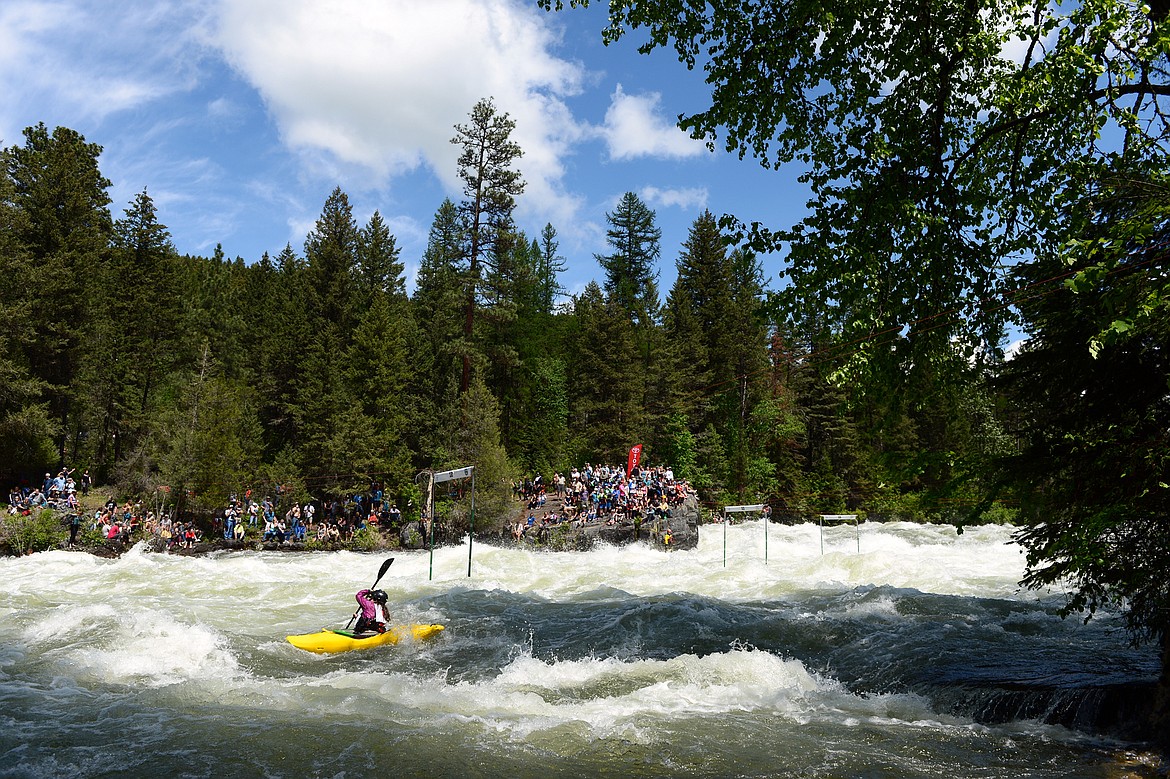 Kayakers navigate the Swan River during the Expert Slalom event at the Bigfork Whitewater Festival in Bigfork on Saturday. (Casey Kreider/Daily Inter Lake)