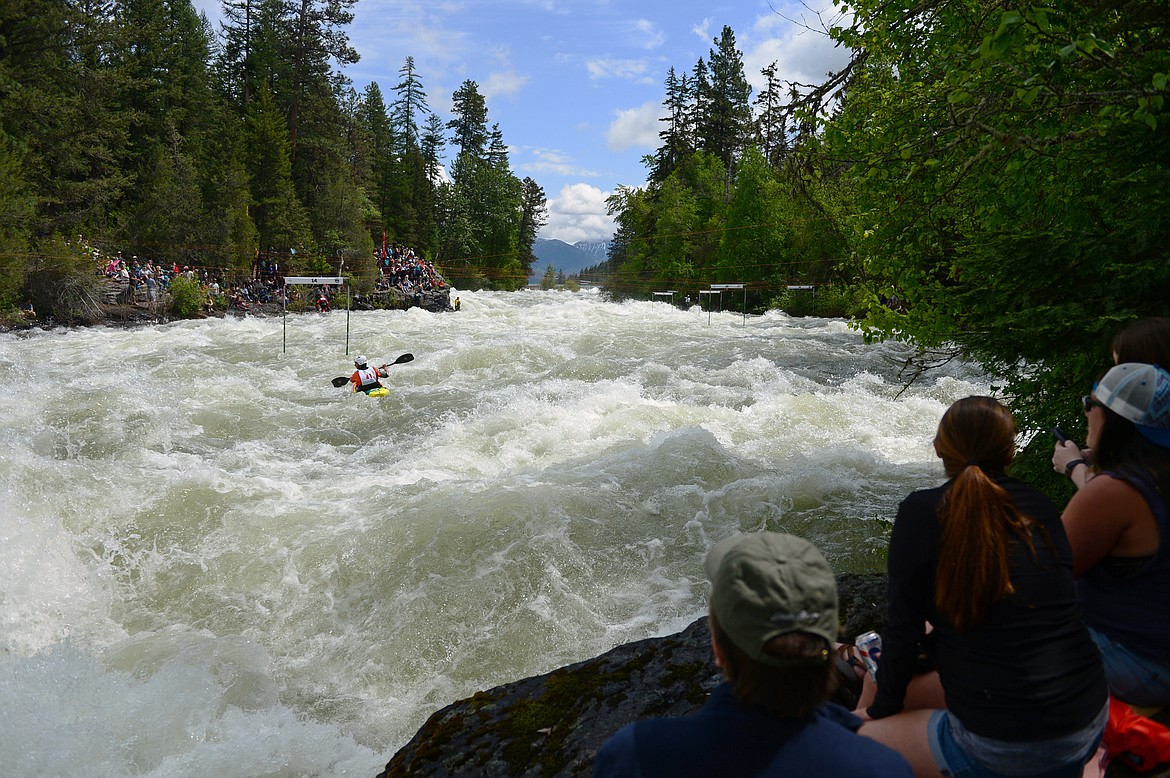 Kayakers navigate the Swan River during the Expert Slalom event at the Bigfork Whitewater Festival in Bigfork on Saturday. (Casey Kreider/Daily Inter Lake)