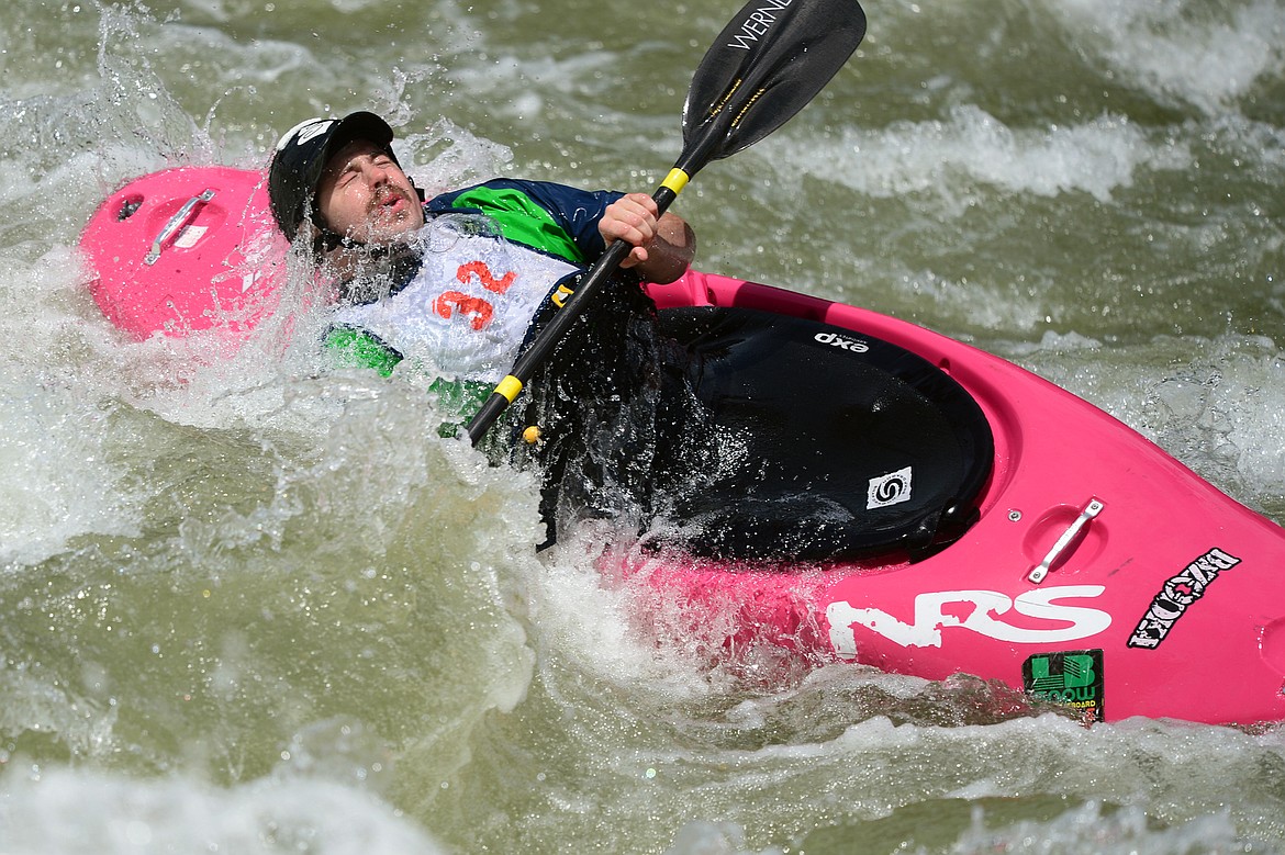 Kayakers navigate the Swan River during the Expert Slalom event at the Bigfork Whitewater Festival in Bigfork on Saturday. (Casey Kreider/Daily Inter Lake)