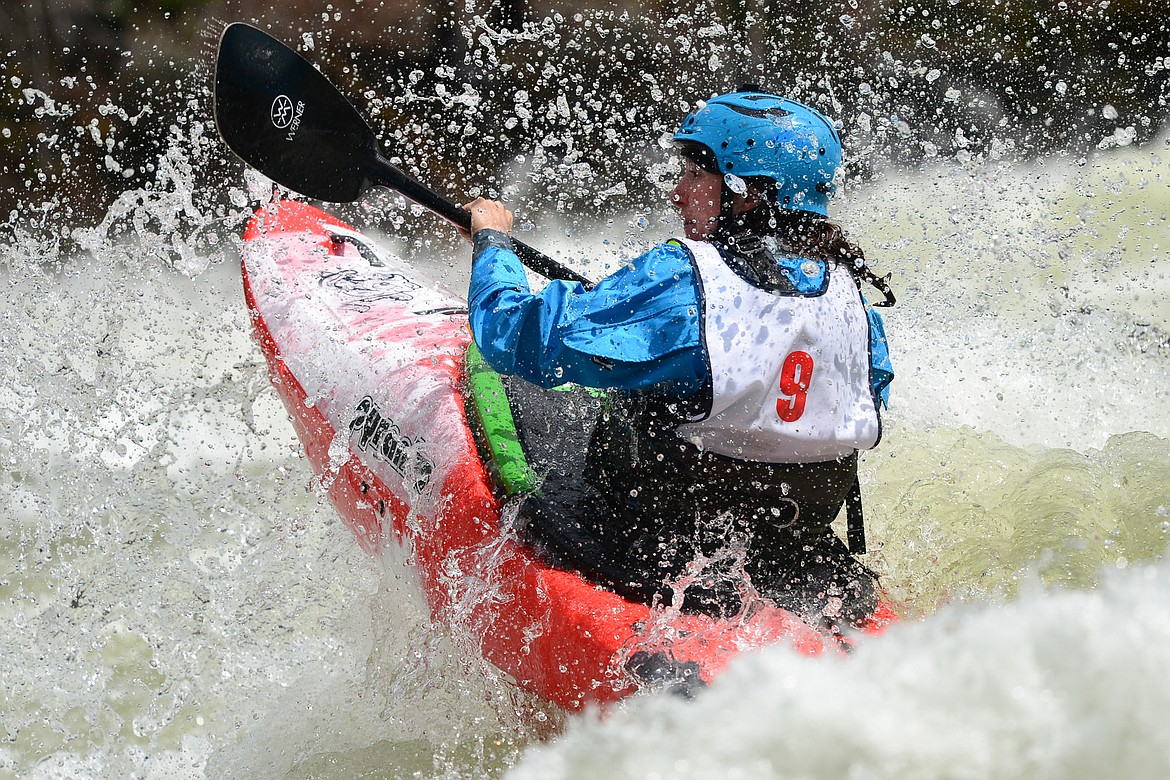 Kayakers navigate the Swan River during the Expert Slalom event at the Bigfork Whitewater Festival in Bigfork on Saturday. (Casey Kreider/Daily Inter Lake)