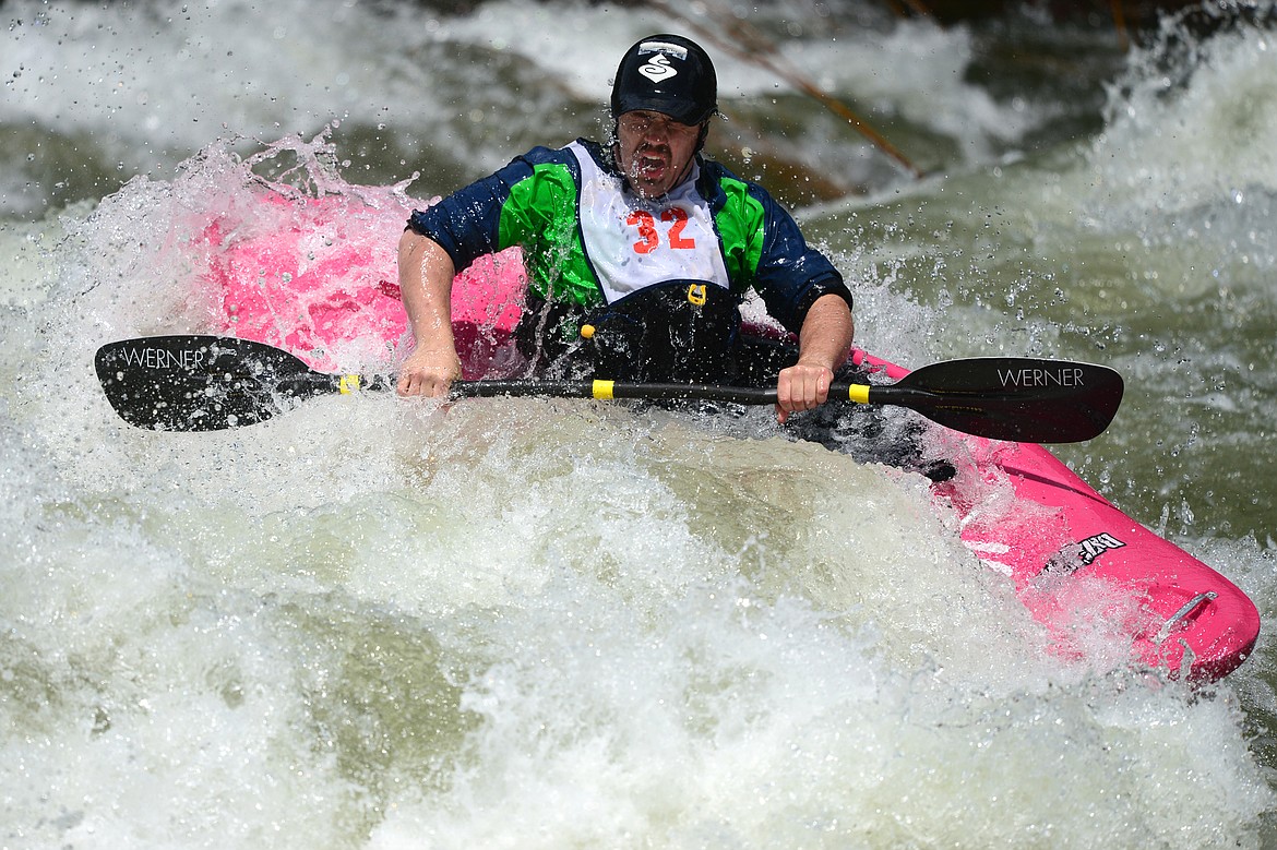 Kayakers navigate the Swan River during the Expert Slalom event at the Bigfork Whitewater Festival in Bigfork on Saturday. (Casey Kreider/Daily Inter Lake)