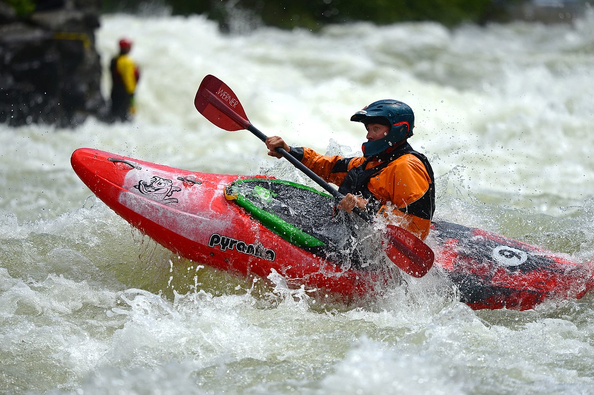 Kayakers navigate the Swan River during the Expert Slalom event at the Bigfork Whitewater Festival in Bigfork on Saturday. (Casey Kreider photos/Daily Inter Lake)