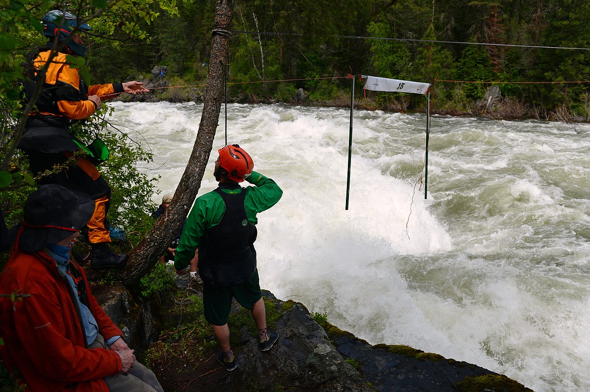 Festival organizers work to adjust a gate on a section of rapids along the Swan River during the Bigfork Whitewater Festival on Saturday. (Casey Kreider/Daily Inter Lake)