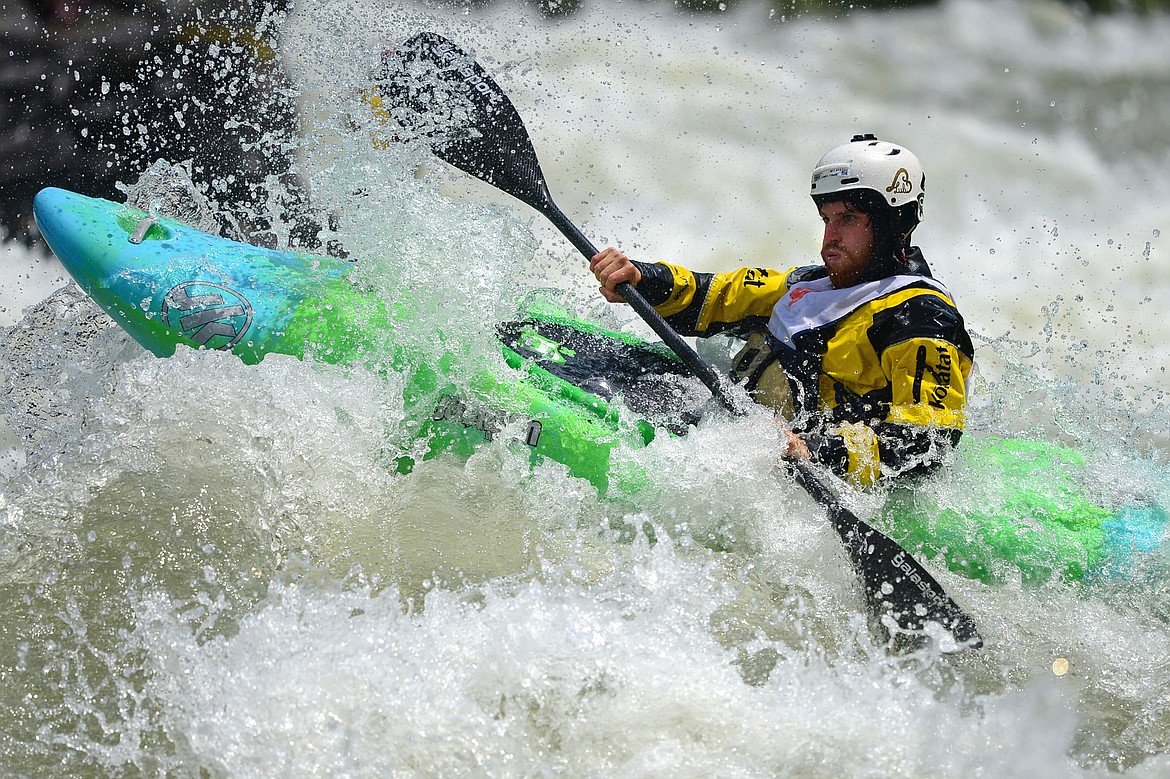 Kayakers navigate the Swan River during the Expert Slalom event at the Bigfork Whitewater Festival in Bigfork on Saturday. (Casey Kreider/Daily Inter Lake)