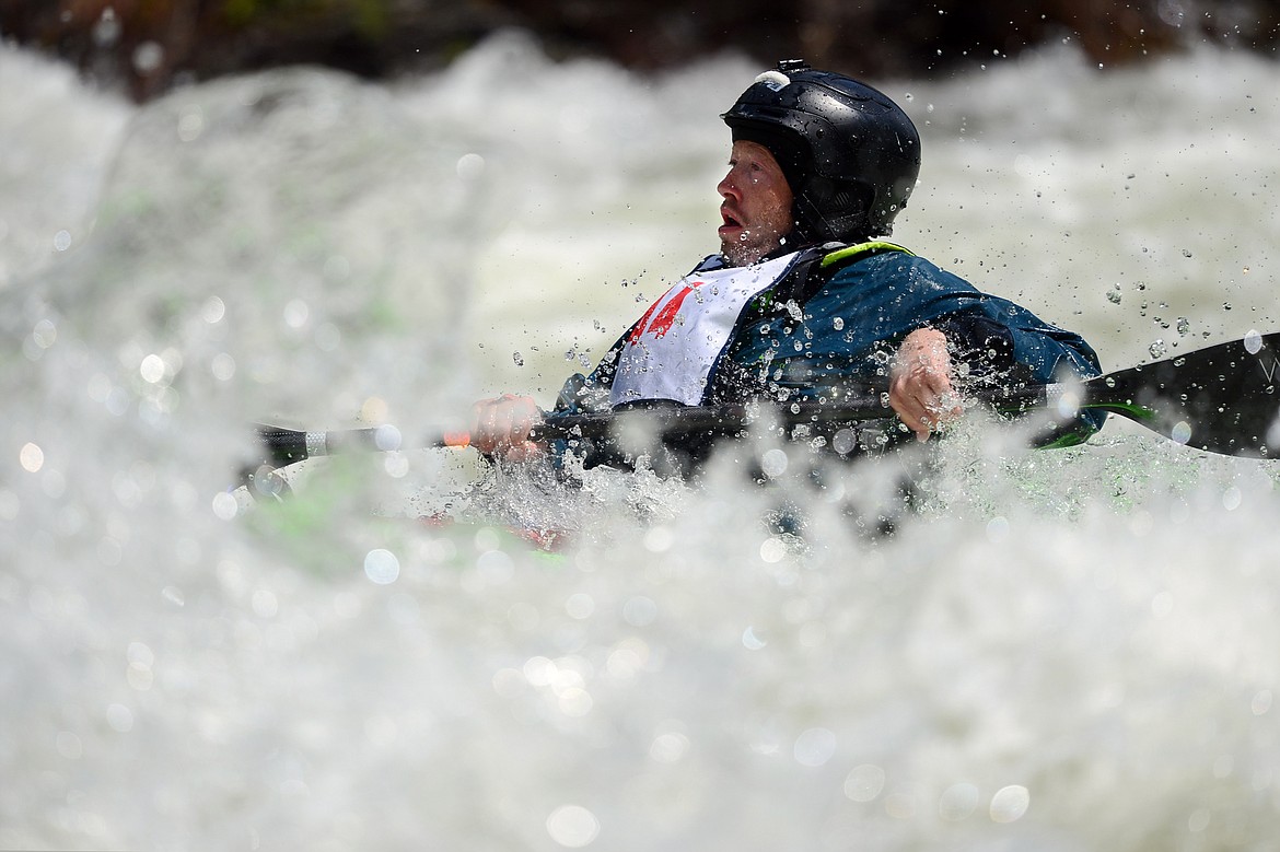 Kayakers navigate the Swan River during the Expert Slalom event at the Bigfork Whitewater Festival in Bigfork on Saturday. (Casey Kreider/Daily Inter Lake)