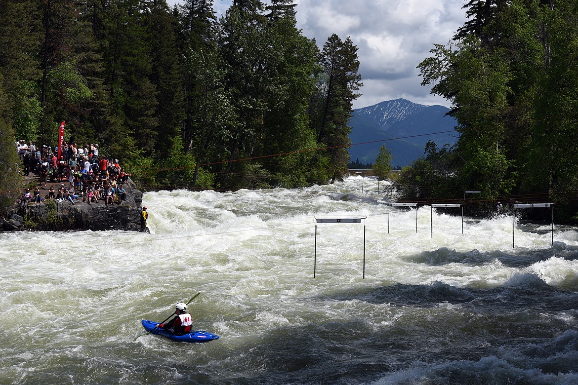 Kayakers navigate the Swan River during the Expert Slalom event at the Bigfork Whitewater Festival in Bigfork on Saturday. (Casey Kreider/Daily Inter Lake)