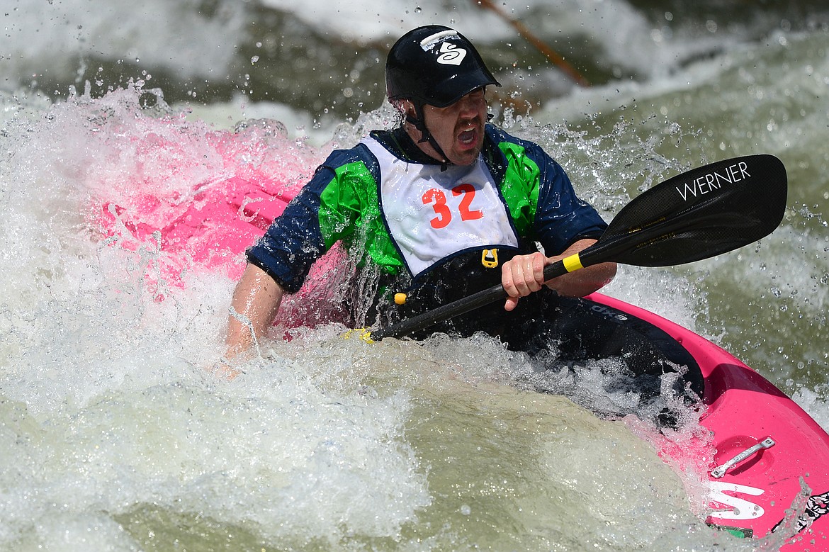 Kayakers navigate the Swan River during the Expert Slalom event at the Bigfork Whitewater Festival in Bigfork on Saturday. (Casey Kreider/Daily Inter Lake)