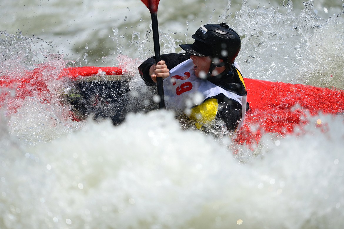 Kayakers navigate the Swan River during the Expert Slalom event at the Bigfork Whitewater Festival in Bigfork on Saturday. (Casey Kreider/Daily Inter Lake)