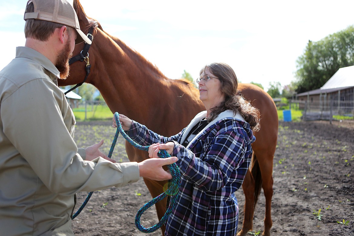 Medicine Horse Center owner Natalie Norrell hands Molly&#146;s lead rope over to veteran Jim Vincent. (Mackenzie Reiss/Daily Inter Lake)