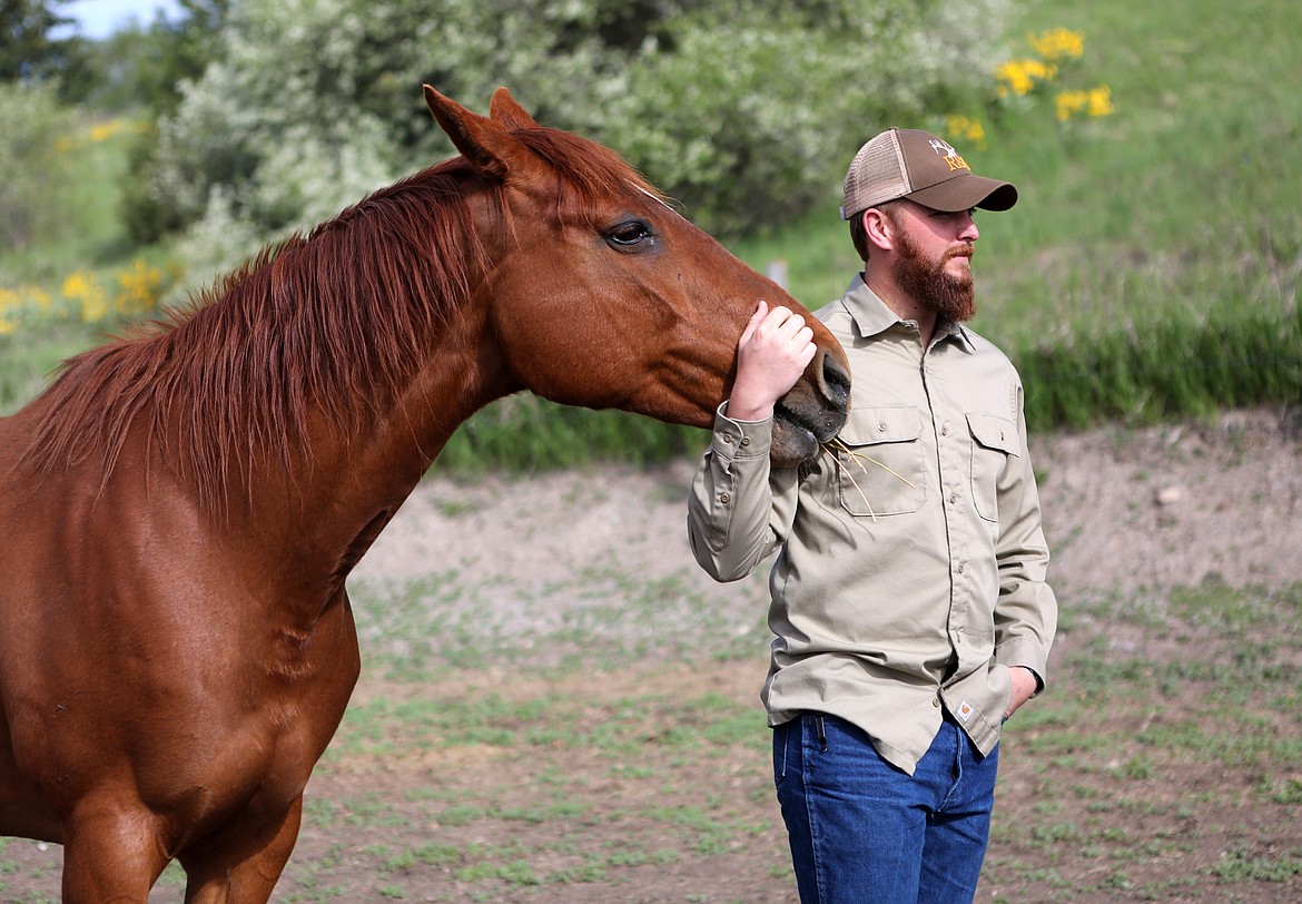 Veteran Jim Vincent, 25, of Kalispell bonds with Molly during a Saturday morning horse therapy session with counselor and equine assisted mental health practicioner Natalie Norrell. (Mackenzie Reiss/Daily Inter Lake)