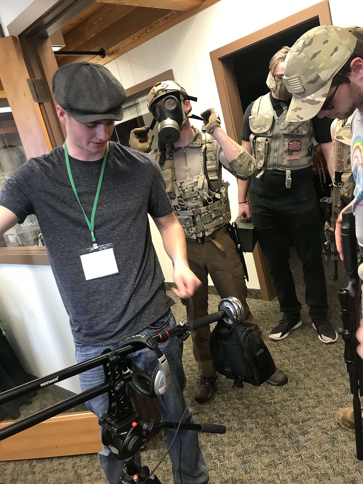 Taylor Riley, left, in gray cap, prepares some equipment as the &quot;mercenaries&quot; suit up for the next scene of &quot;Odd or Even,&quot; an original film written and directed by Taylor. The film will premiere Tuesday, May 29 at 5 p.m. in the Hayden Discount Cinemas. Admission is $3. (Courtesy photo)