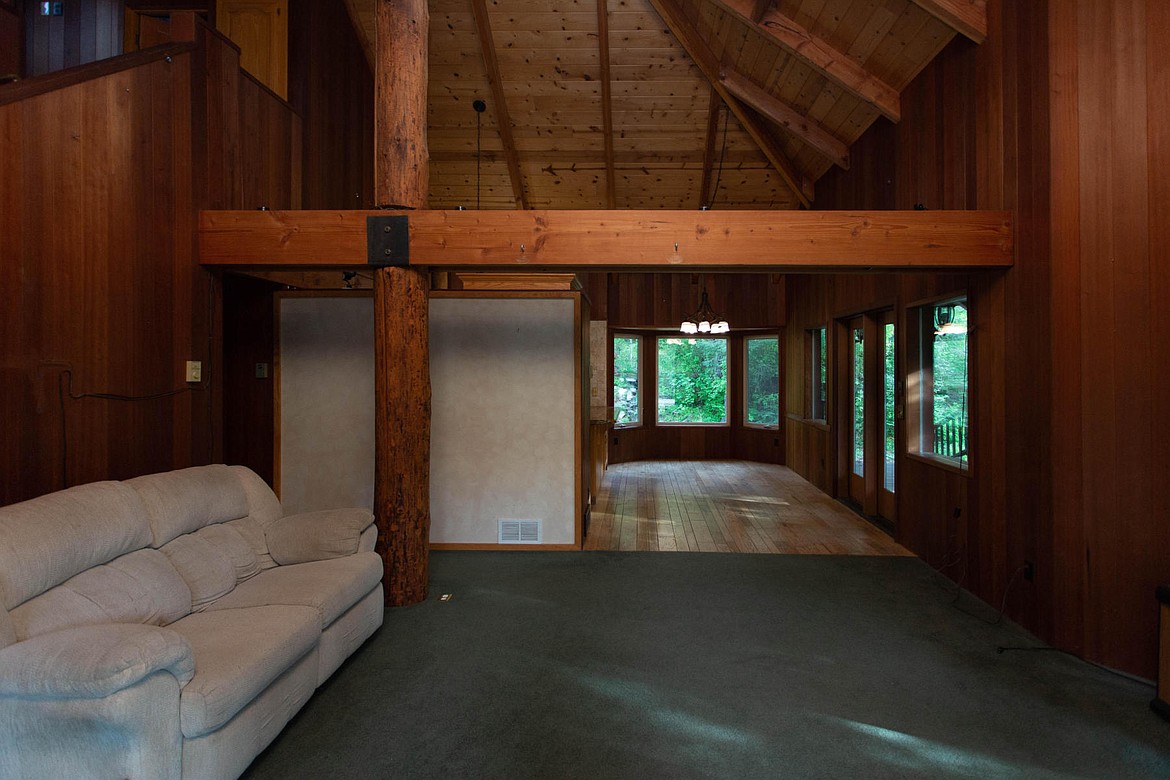 The living room sits empty at the vacant former home of Lori and Larry Isenberg.