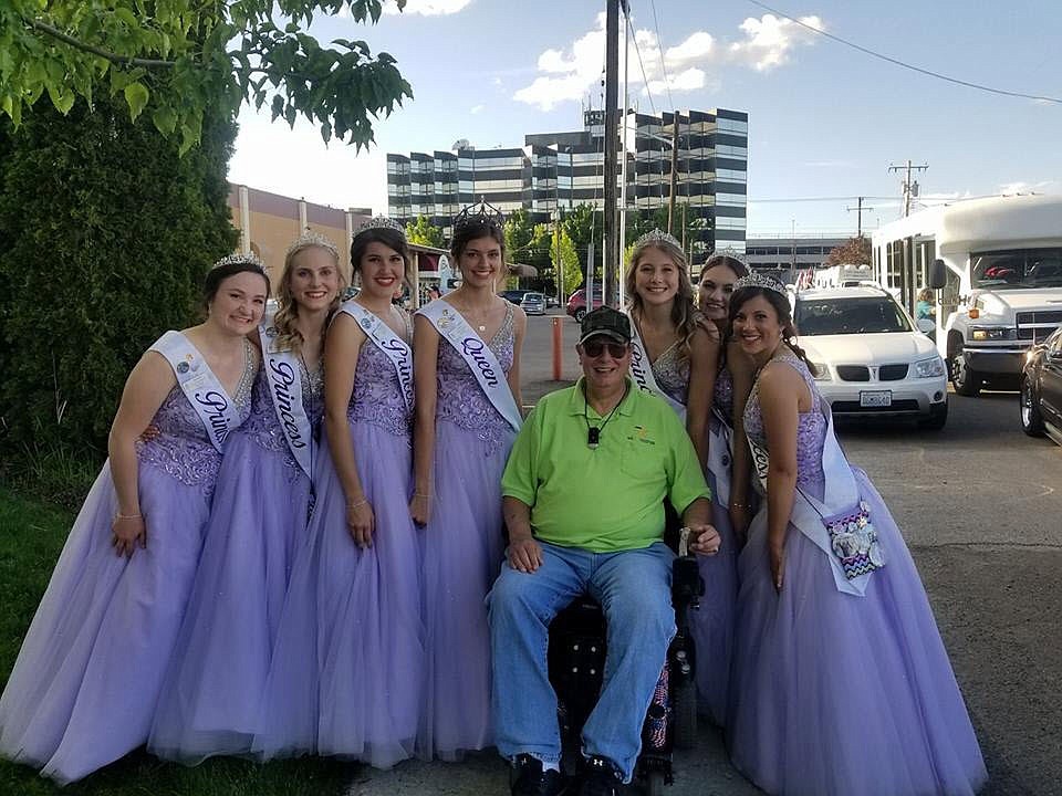 Courtesy photo
DAV No. 9 Commander Fred Margiotta surrounded by the Lilac Royalty prior to the 2018 Armed Forces Torchlight Parade Saturday in Spokane.