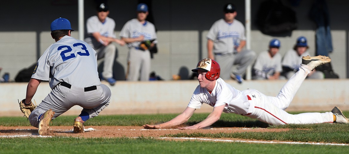 Kalispell Lakers B Jack Corriveau is tagged out at home by Libby pitcher Garrett Gollohon after attempting to score on a wild pitch in the bottom of the second inning. (Casey Kreider/Daily Inter Lake)