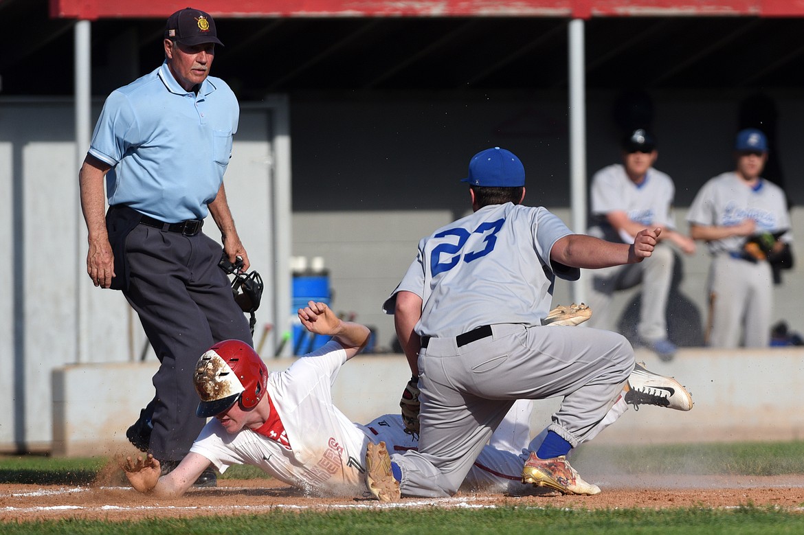 Kalispell Lakers B Jack Corriveau is tagged out at home by Libby pitcher Garrett Gollohon after attempting to score on a wild pitch in the bottom of the second inning. (Casey Kreider/Daily Inter Lake)