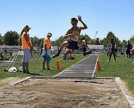 Gavin Strom makes his record-breaking long jump at the State Meet on Saturday. (Courtesy photo)