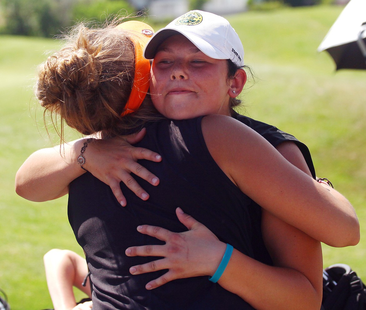 Rodney Harwood/Columbia Basin Herald
Kenedee Peters of Ephrata is congratulated by a teammate after winning the 2A state medalist honor for the third time in four years Wednesday afternoon at Horn Rapids Golf Course in Richland.