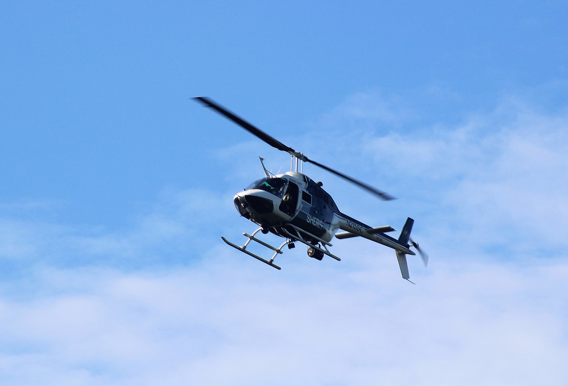 Photo by CHANSE WATSON
The helicopter continues its search down the river toward Cataldo.