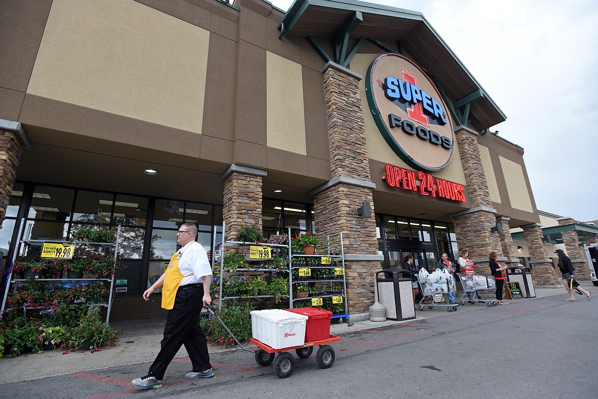 George Tyler delivers a Super 1 Smart Click order at Super 1 Foods in Kalispell.