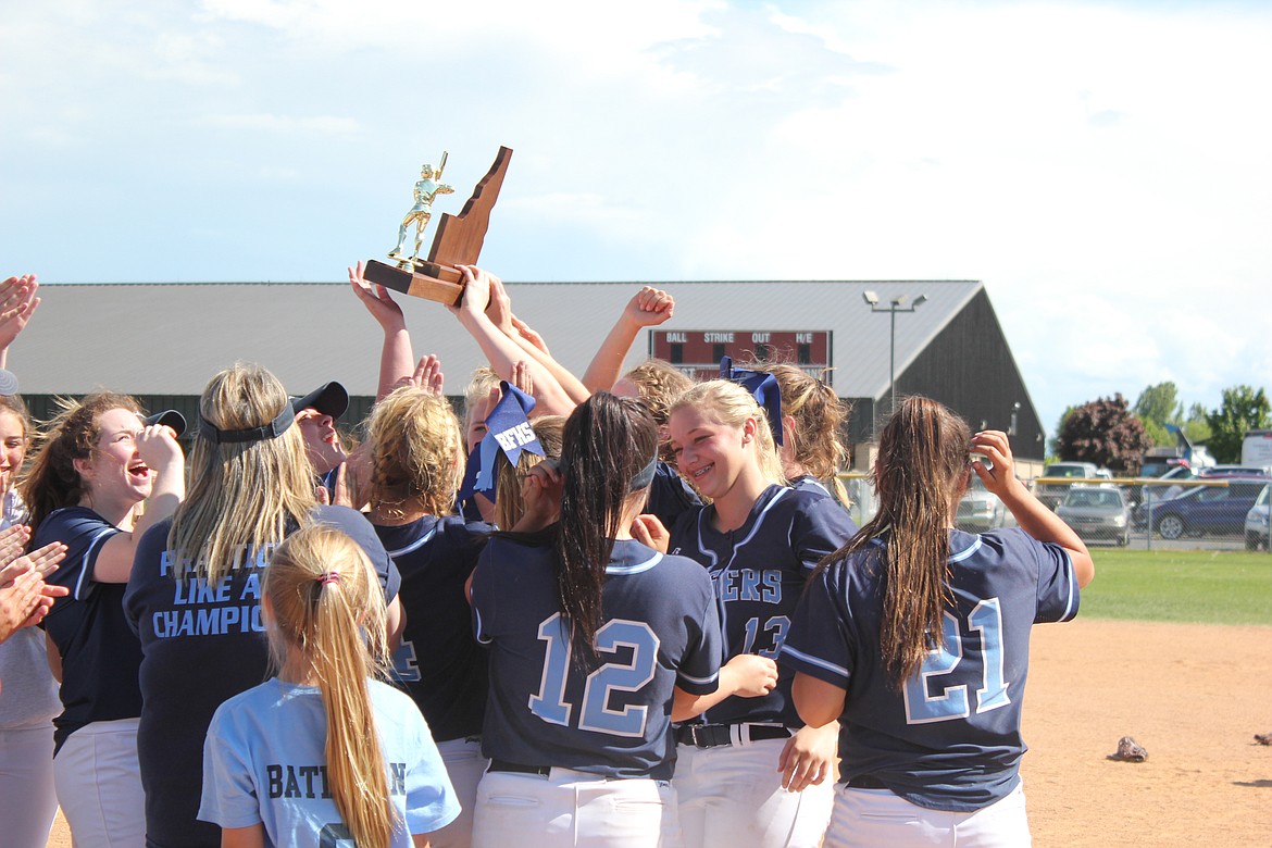 Courtesy Photo
The lady Badgers show their pride in winning the second place trophy at the 3A State Softball Tournament.