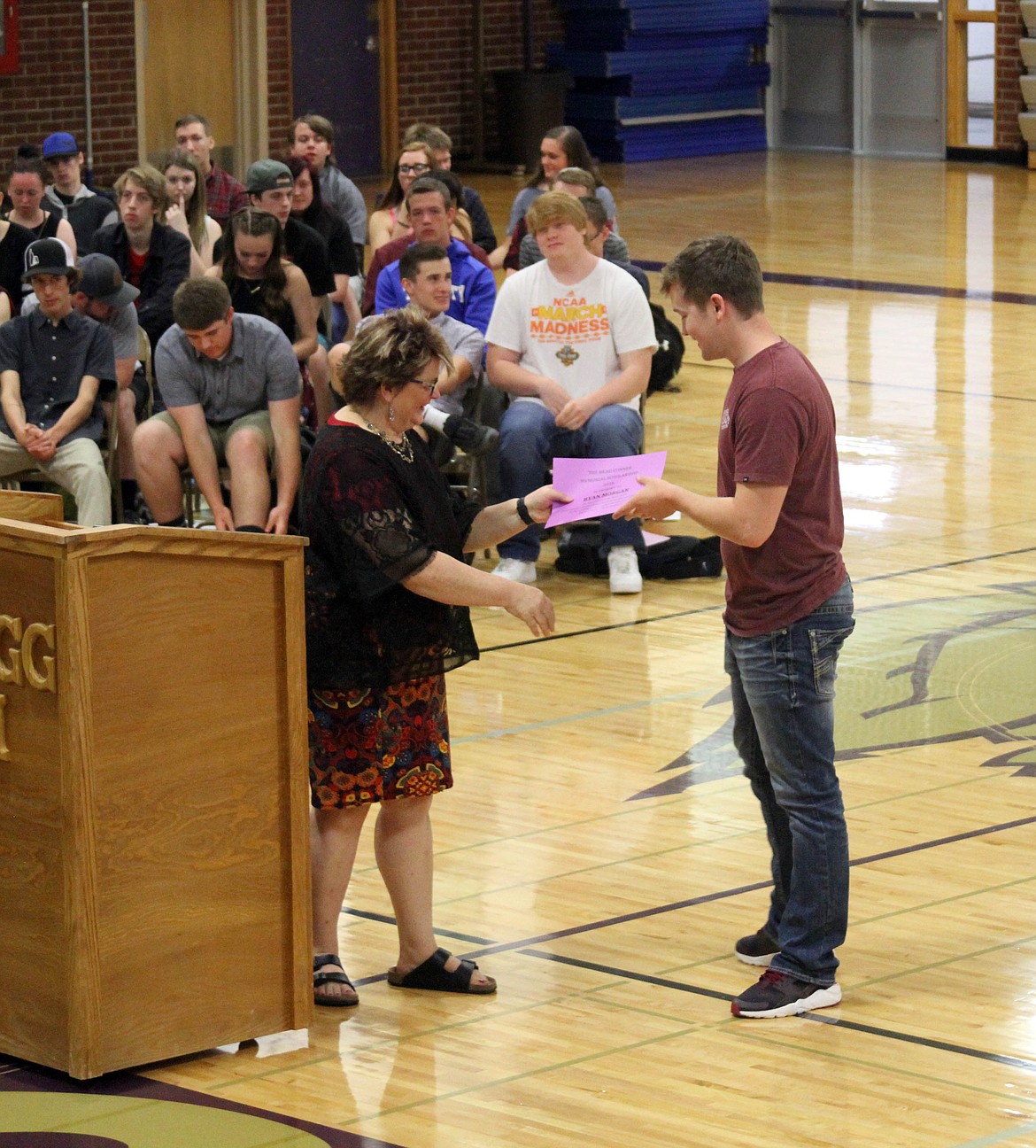 Photo by JOSH MCDONALD/ Kellogg senior Ryan Morgan shakes presenter Carol Roberts&#146; hand as he receives the Brad Conner Memorial Scholarship during Kellogg High School&#146;s scholarship ceremony earlier this week.