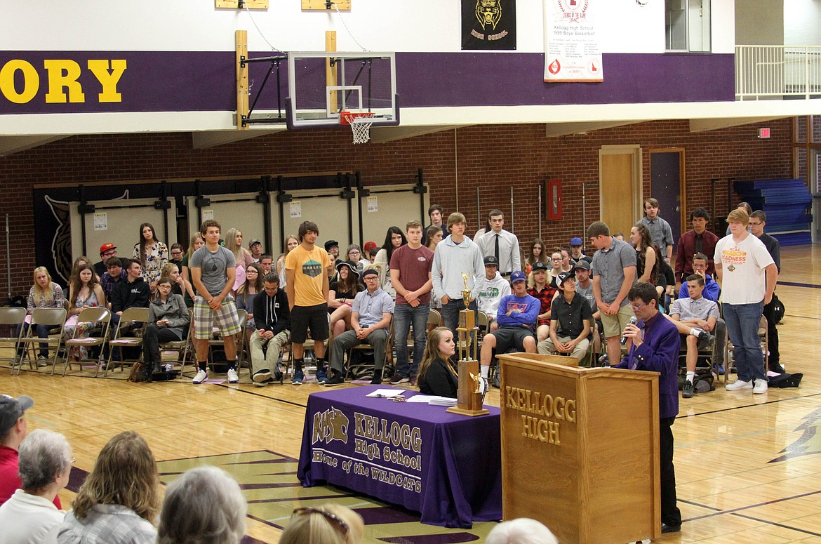 Photo by JOSH MCDONALD/ Paul Roberts reads aloud the names of the KHS seniors (standing) who are eligible for scholarships through the University of Idaho.