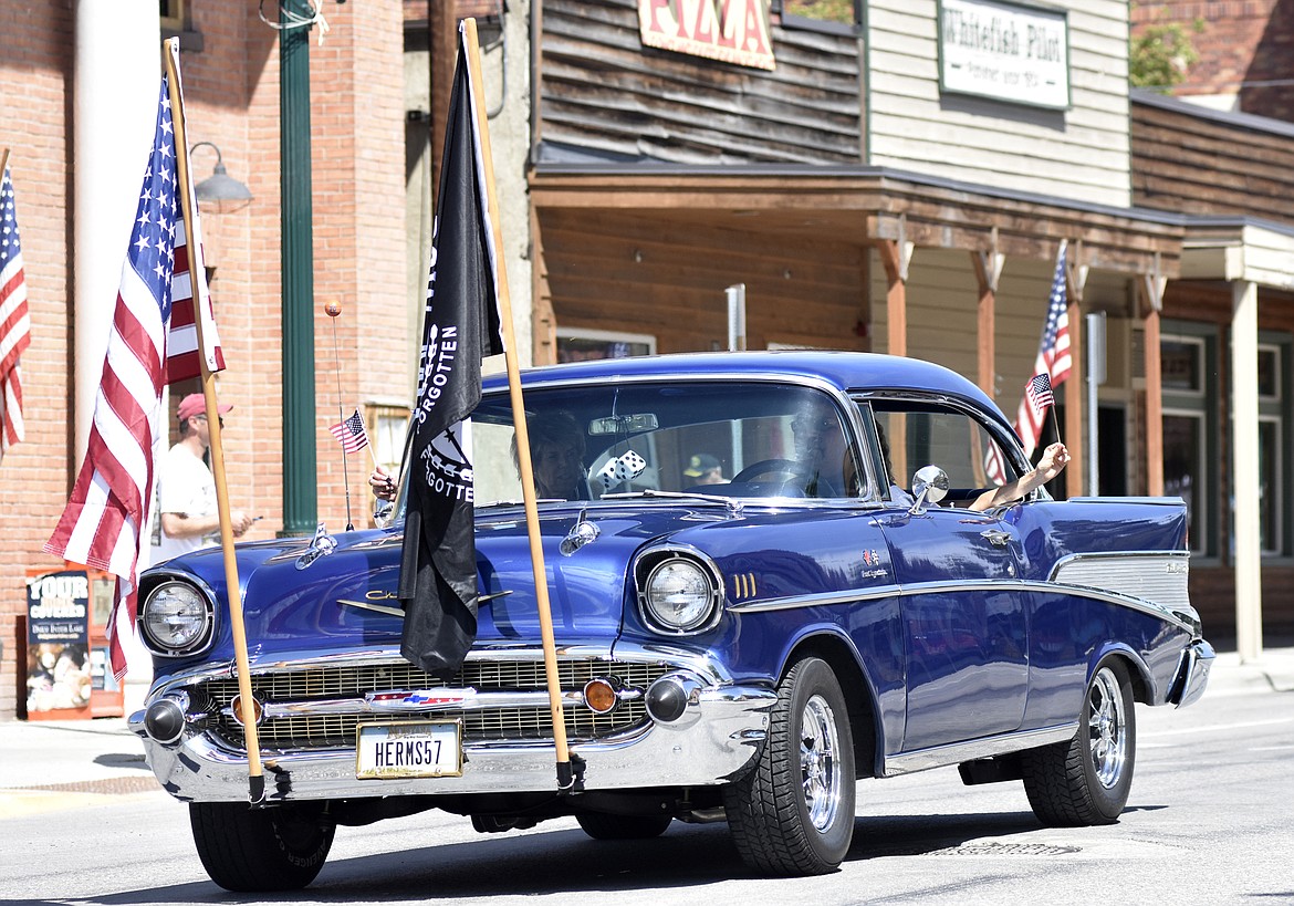 A car makes its way down Second Street Monday afternoon for the annual Memorial Day Parade. (Heidi Desch/Whitefish Pilot)