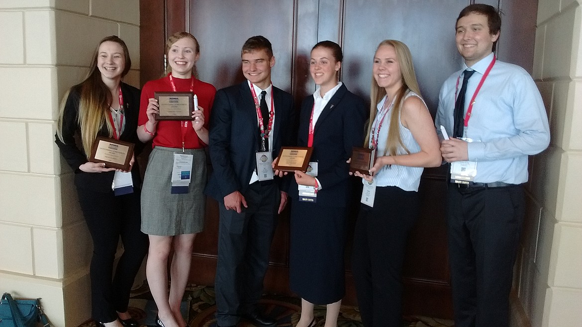 From Left to right: Kylee Thompson, Anna Sanford, Ian Farris, Madison Kelly, Emma Hill, and Connor Dunlap pose with chapter awards and their torches from the Torch Awards. (Photo courtesy of Laurie Koepplin)