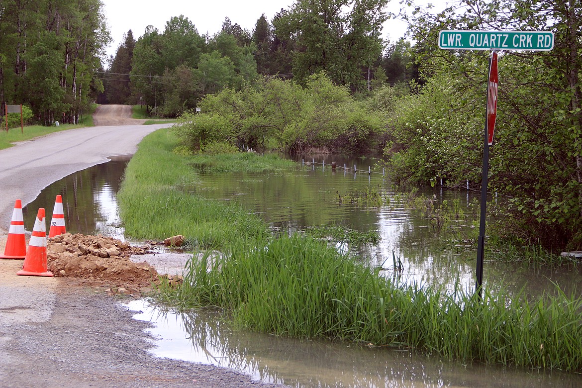 (Photo by MARY MALONE)The Priest River rose up across a private property and flooded across Lower Quartz Creek Road and into Peninsula Road, next to the Green Owl Tavern.