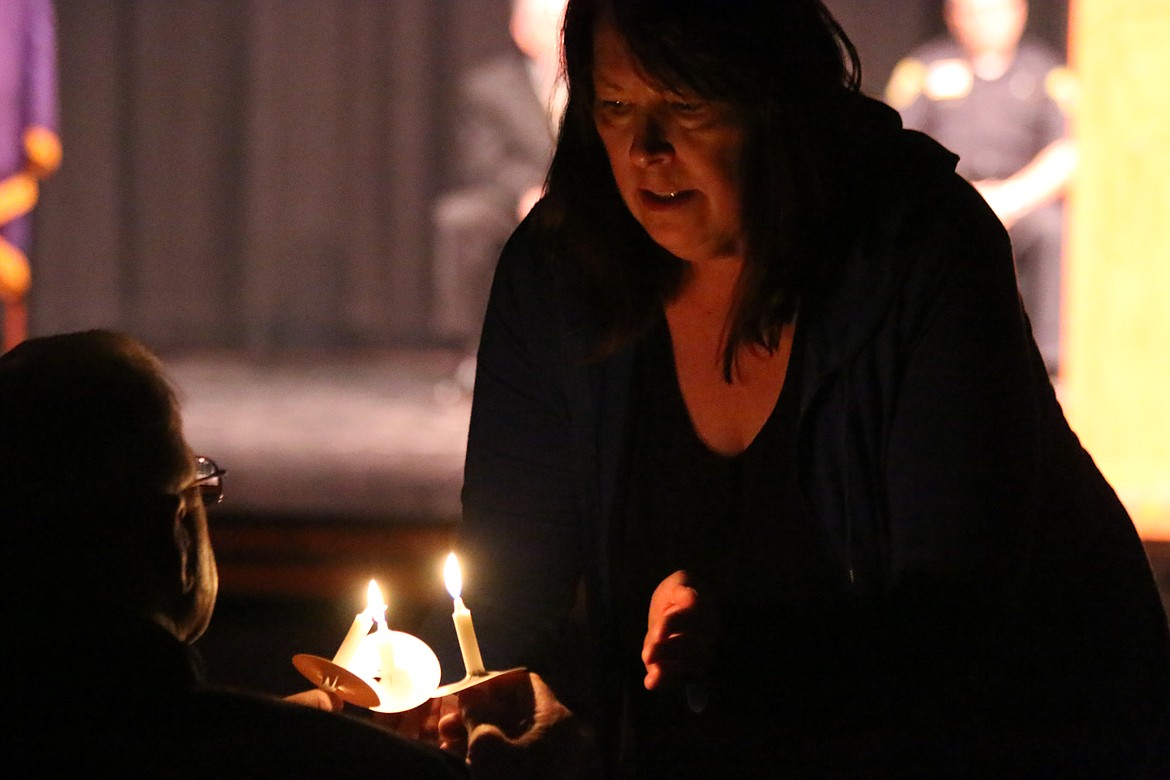 Photo by MANDI BATEMAN
The candlelight vigil began as people passed their flames from one to another.