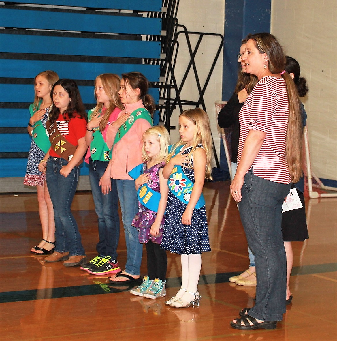 Girl Scout Troop 3801 leads the Pledge of Allegiance during Armed Forces Day celebrations in Superior on Saturday. (Kathleen Woodford/Mineral Independent)