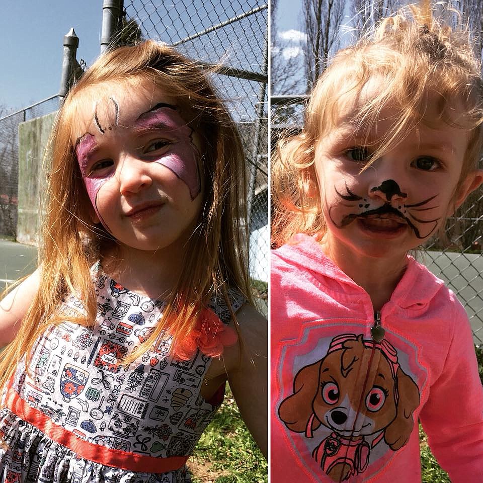 Sisters, Mataea (4) and Kenadi (2) show off their painted faces thanks to the talents of Terry Zylawy during a Pool in the Park fundraiser on April 22 in Superior. (Photo courtesy of Pool in the Park)