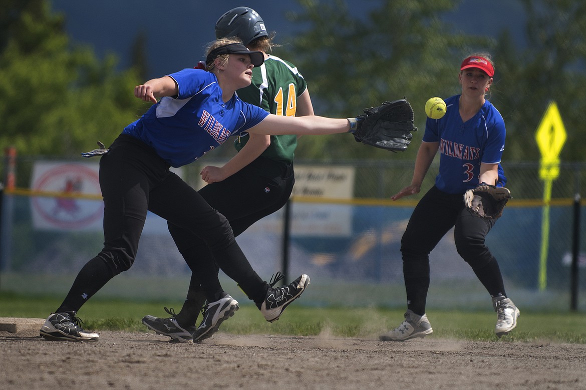 Trista Cowan makes a play on a ball at second base against Whitefish Saturday while teammate Chloe Kienas looks on. (Jeremy Weber photo)