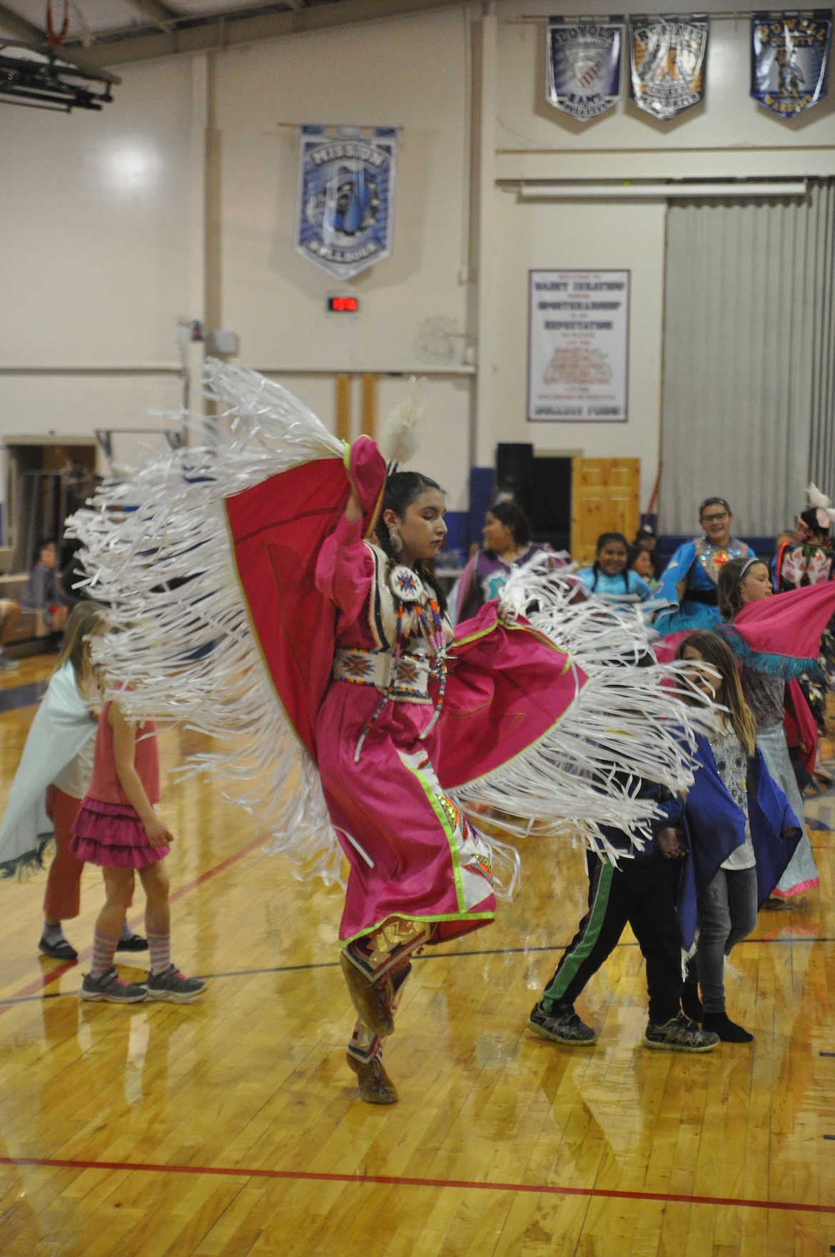 TATIANA WELLS, a fifth grader at St. Ignatius Middle School, participates in the district&#146;s pow wow, celebrating the end of the school year. (Ashley Fox/Lake County Leader)