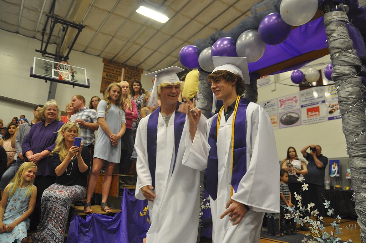 TYSON PETTICREW, left, and Sabin Perry make their entrance to the front of the Charlo gymnasium Sunday. (Ashley Fox/Lake County Leader)