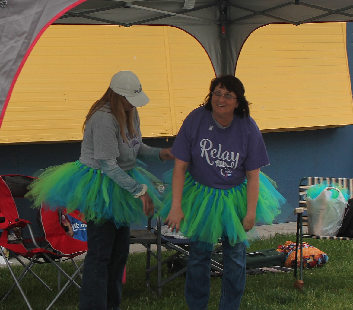 Joel Martin/Columbia Basin Herald
Karen Okerlund, left, and Amber Jacobs don tutus in Big Bend colors to walk the Relay for Life Friday.