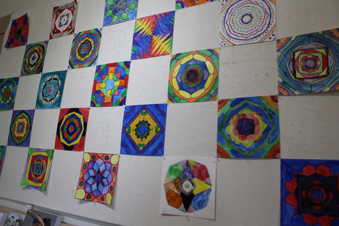 Chanet Stevenson/The Sun Tribune - Colorful mandalas created by students at McFarland Middle School adorn a wall in the Old Hotel and Art Gallery.