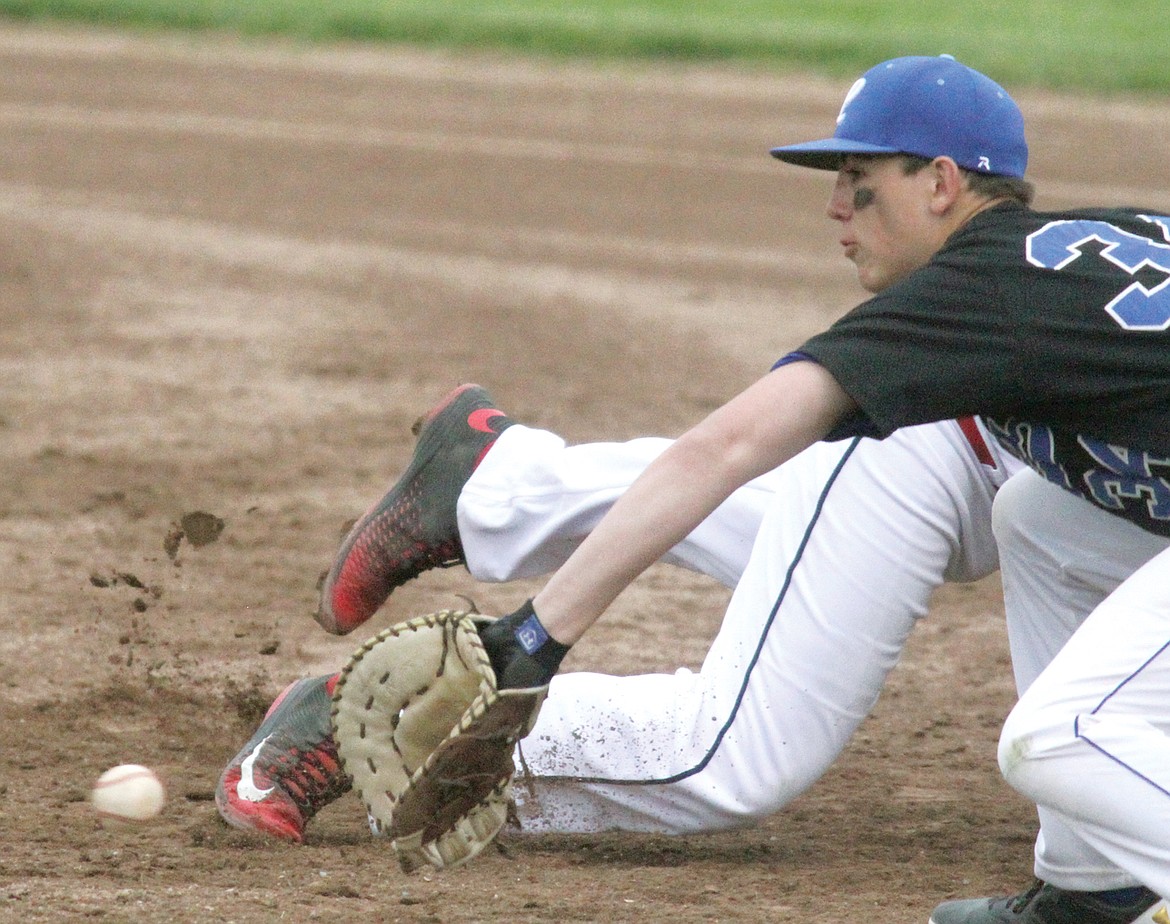 First baseman Trey Thompson checks his runner on a throw from pitcher Tim Carvey top of sixth inning vs. Clark Fork Cougs Friday. (Paul Sievers/The Western News)