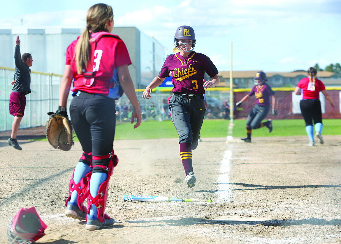 Connor Vanderweyst/Columbia Basin Herald
Moses Lake pinch-runner Emily Ausere reaches home plate safely against Eastmont.