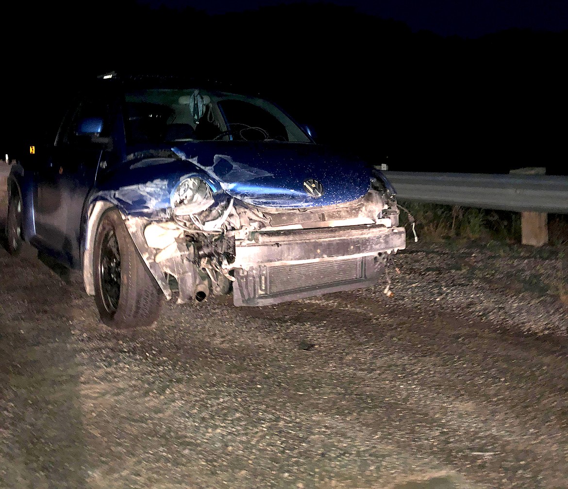 A Volkswagen Beetle is pictured after it collided with a guard rail on Montana 135 on Saturday night. (Erin Jusseaume/ Clark Fork Valley Press)