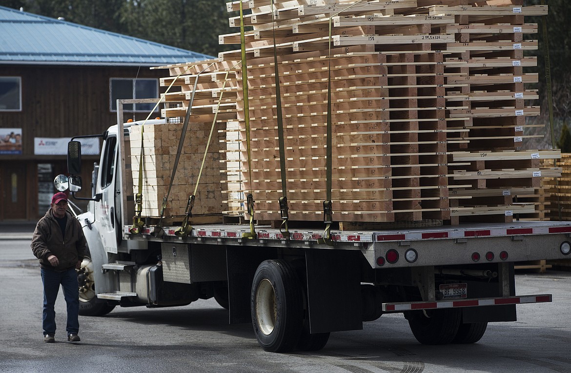 Pallets are loaded onto a truck before shipment to a customer.
