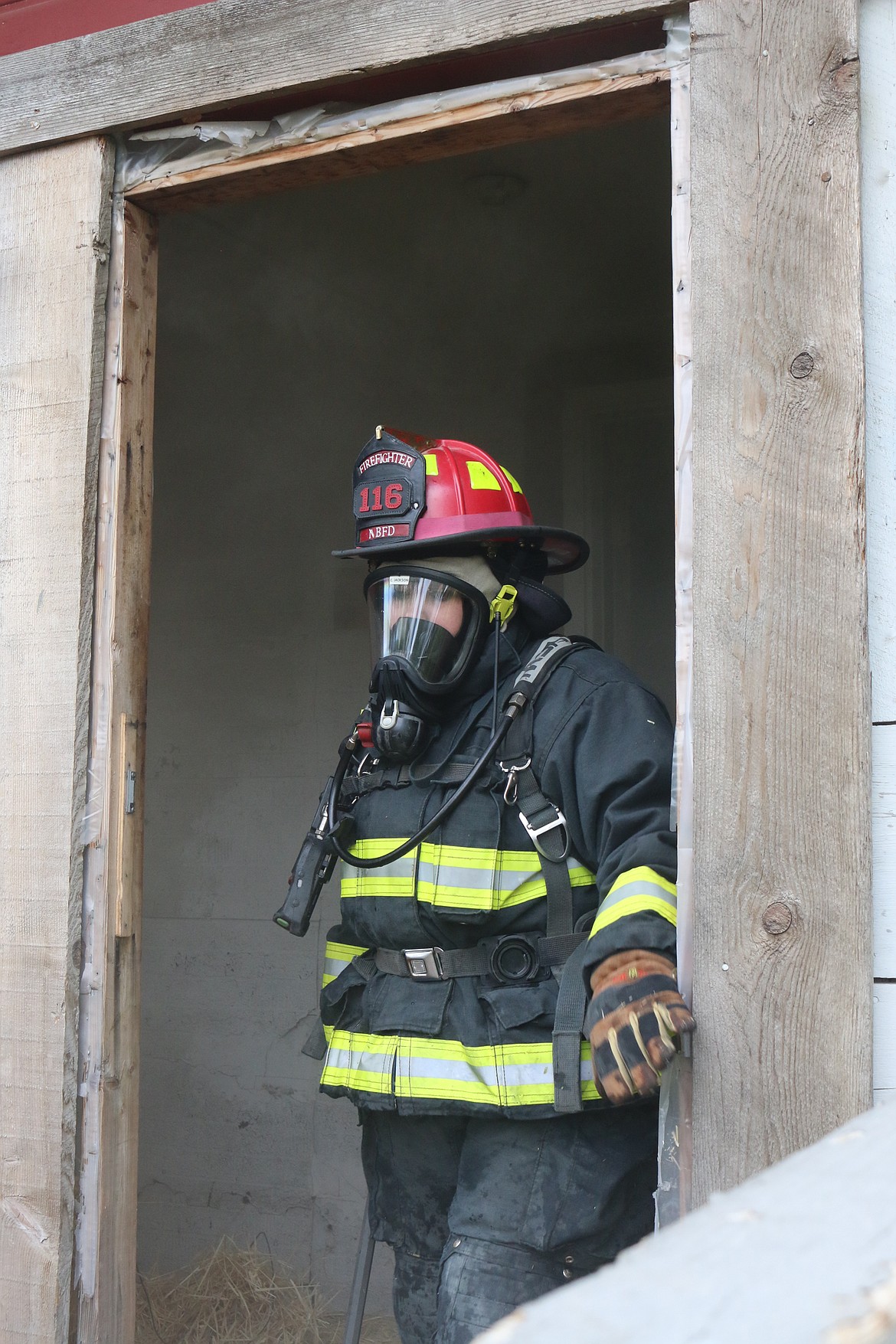 Photo by MANDI BATEMAN
North Bench Firefighter Cheryl Jackson emerges after a successful fire training session, called an evolution.