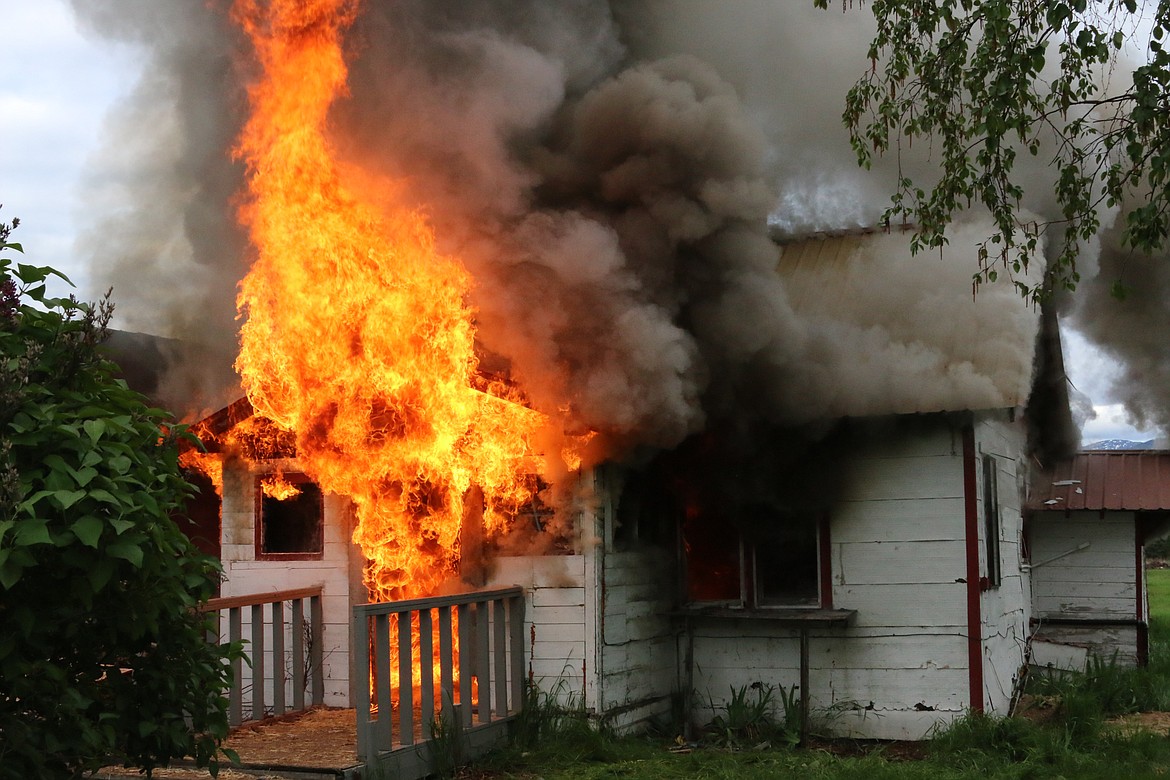 Photo by MANDI BATEMAN
Scenes from the burning house on May 19, during the live burn training consisting of multiple agencies.