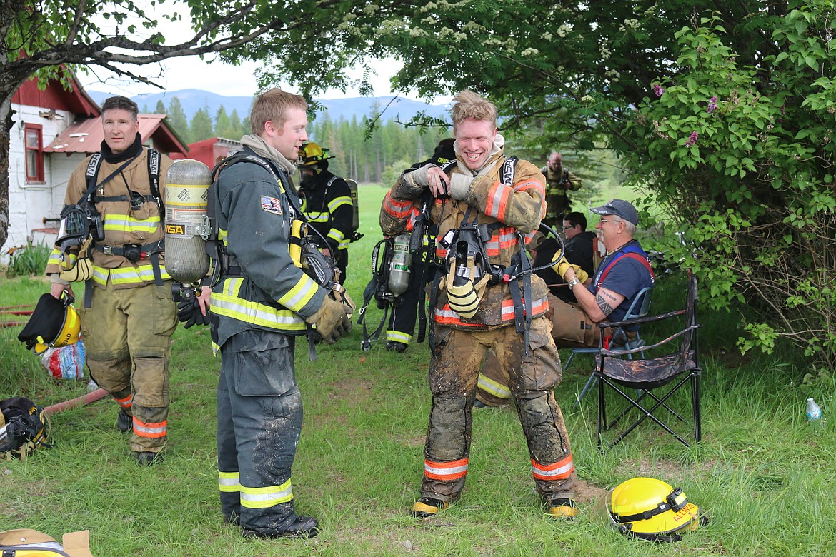 Photo by MANDI BATEMAN
North Bench Firefighter Granite Allinger with his brother, Hall mountain Firefighter Ben Allinger during the live fire training.