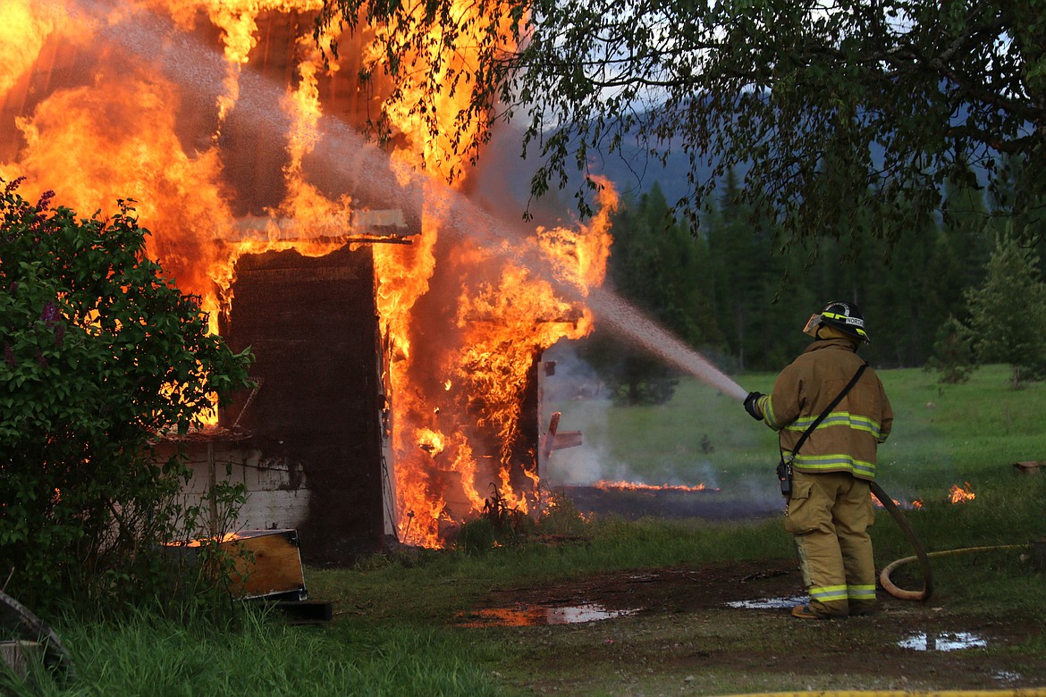 Photo by MANDI BATEMAN
Scenes from the burning house on May 19, during the live burn training consisting of multiple agencies.